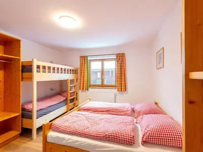 Ein Bett oder Betten in einem Zimmer der Unterkunft Farmhouse in Bramberg with Natural Pond
