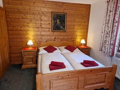 Ein Bett oder Betten in einem Zimmer der Unterkunft Pension Alpenrose