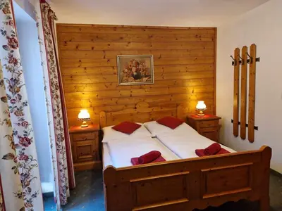 Ein Bett oder Betten in einem Zimmer der Unterkunft Pension Alpenrose