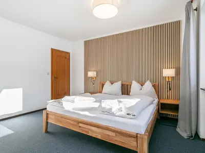 Ein Bett oder Betten in einem Zimmer der Unterkunft Brixen Alpin Living Top 1 und 2 und 3