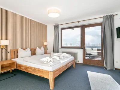 Ein Bett oder Betten in einem Zimmer der Unterkunft Brixen Alpin Living Top 1 und 2 und 3