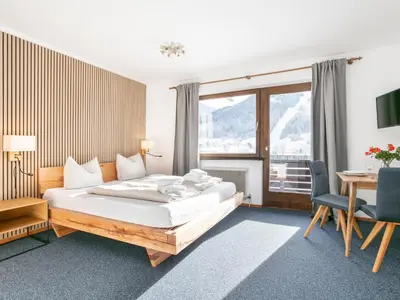 Ein Bett oder Betten in einem Zimmer der Unterkunft Brixen Alpin Living Top 9 und 10