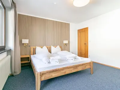 Ein Bett oder Betten in einem Zimmer der Unterkunft Brixen Alpin Living Top 7