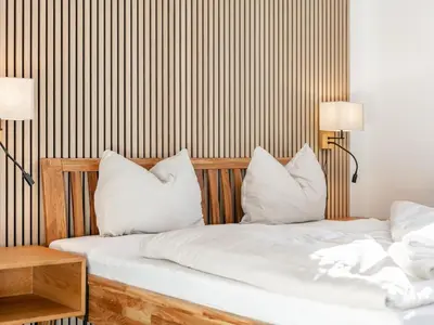 Ein Bett oder Betten in einem Zimmer der Unterkunft Brixen Alpin Living Top 2