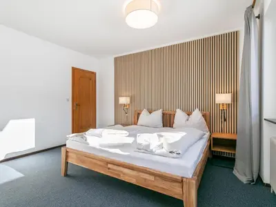Ein Bett oder Betten in einem Zimmer der Unterkunft Brixen Alpin Living Top 2