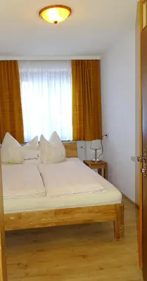 Ein Bett oder Betten in einem Zimmer der Unterkunft Apartment Haus Janine