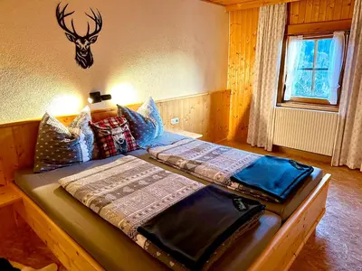 Ein Bett oder Betten in einem Zimmer der Unterkunft Veitenhof Alm im autofreien Kaisertal