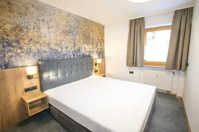 Ein Bett oder Betten in einem Zimmer der Unterkunft Ferienwohnung Königsleiten 77 - Top 6