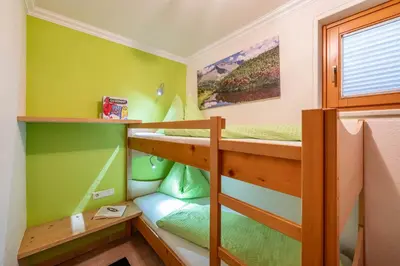 Ein Bett oder Betten in einem Zimmer der Unterkunft Ferienhaus Johanna in Mayrhofen-Hippach- Nähe der Skipiste
