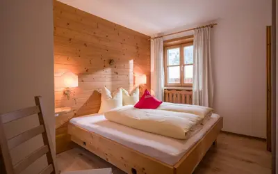 Ein Bett oder Betten in einem Zimmer der Unterkunft Grittlmühle Chalet Ferienwohnungen