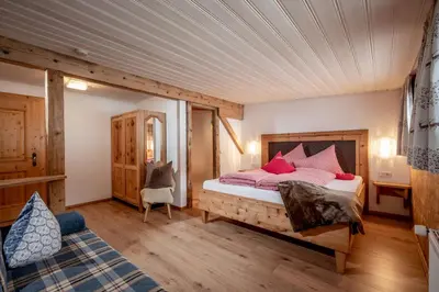 Ein Bett oder Betten in einem Zimmer der Unterkunft Grittlmühle Chalet Ferienwohnungen