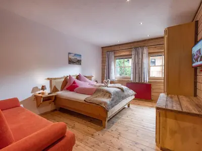 Ein Bett oder Betten in einem Zimmer der Unterkunft Grittlmühle Chalet Ferienwohnungen
