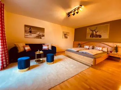Ein Bett oder Betten in einem Zimmer der Unterkunft Chalet Panoramaview Garten Sauna Ski out