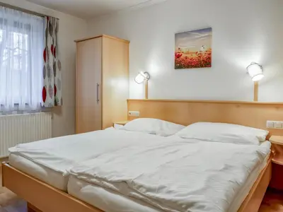 Ein Bett oder Betten in einem Zimmer der Unterkunft Berg und Blüte I