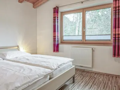 Ein Bett oder Betten in einem Zimmer der Unterkunft Berg und Blüte II