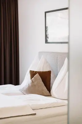 Ein Bett oder Betten in einem Zimmer der Unterkunft Lebe`schlitters - Das Ferienapartmenthaus im Zillertal