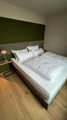 Ein Bett oder Betten in einem Zimmer der Unterkunft GOLDMARIE - Apartments