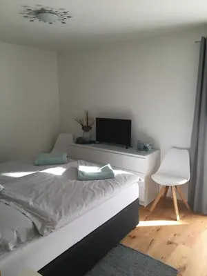 Ein Bett oder Betten in einem Zimmer der Unterkunft Haus Kaiserblick Top 3