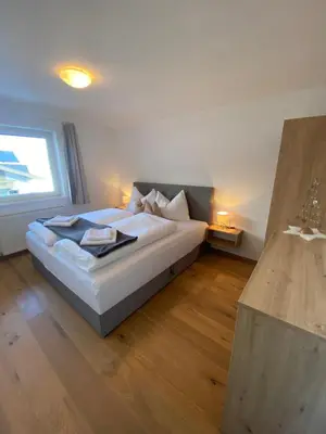 Ein Bett oder Betten in einem Zimmer der Unterkunft Ferienwohnungen Mauracher