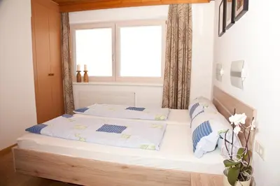 Ein Bett oder Betten in einem Zimmer der Unterkunft Ferienwohnungen Mauracher