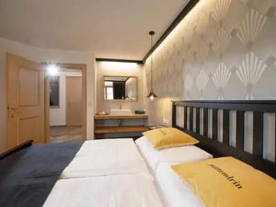 Ein Bett oder Betten in einem Zimmer der Unterkunft Ferienwohnung Mittendrin
