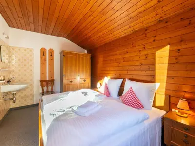 Ein Bett oder Betten in einem Zimmer der Unterkunft Farmhouse in Ramsau near Ski Slopes