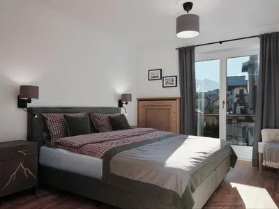 Ein Bett oder Betten in einem Zimmer der Unterkunft Mountain King Chalet