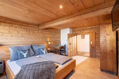 Ein Bett oder Betten in einem Zimmer der Unterkunft Bartlerhof