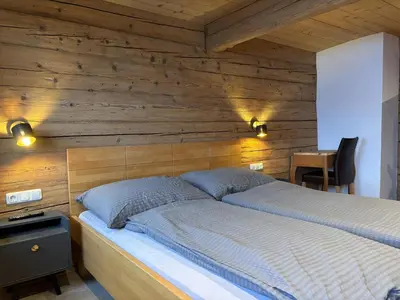 Ein Bett oder Betten in einem Zimmer der Unterkunft Bartlerhof