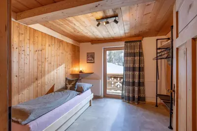 Ein Bett oder Betten in einem Zimmer der Unterkunft Bartlerhof