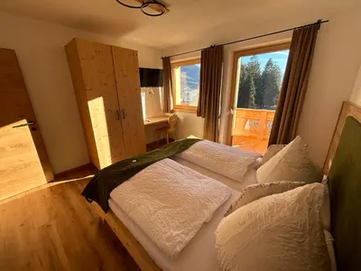 Ein Bett oder Betten in einem Zimmer der Unterkunft Wiererhof