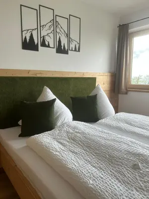 Ein Bett oder Betten in einem Zimmer der Unterkunft Wiererhof