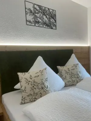Ein Bett oder Betten in einem Zimmer der Unterkunft Wiererhof