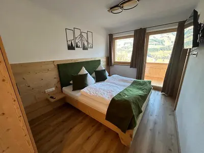 Ein Bett oder Betten in einem Zimmer der Unterkunft Wiererhof