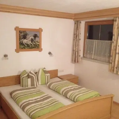 Ein Bett oder Betten in einem Zimmer der Unterkunft Ferienwohnungen Prosser