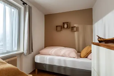 Ein Bett oder Betten in einem Zimmer der Unterkunft Aufi Gehts by Apartment Managers