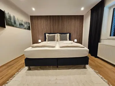 Ein Bett oder Betten in einem Zimmer der Unterkunft Apartments Shema