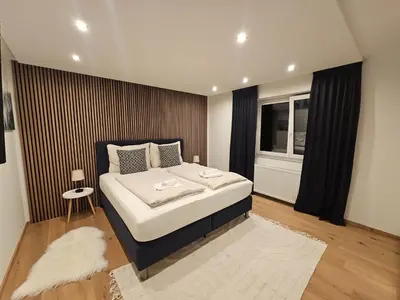 Ein Bett oder Betten in einem Zimmer der Unterkunft Apartments Shema