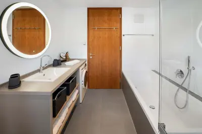 Ein Badezimmer in der Unterkunft Modern garden apartment with sauna near ski lift