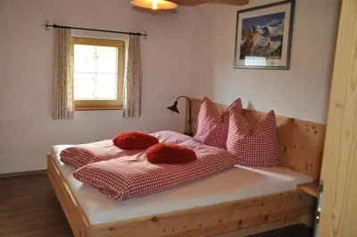 Ein Bett oder Betten in einem Zimmer der Unterkunft Berghütte Ahornblick