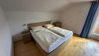 Ein Bett oder Betten in einem Zimmer der Unterkunft Apartment Garber