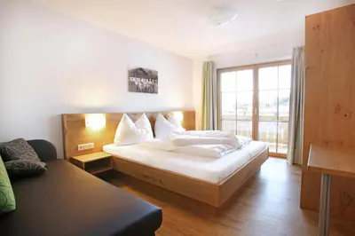 Ein Bett oder Betten in einem Zimmer der Unterkunft Tarlack Appartements Hütten 1a