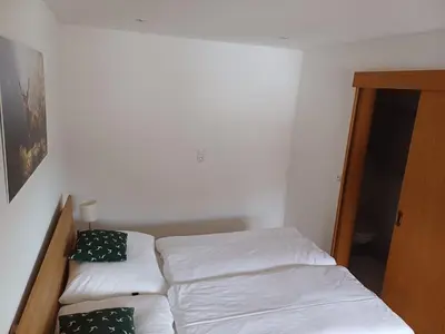 Ein Bett oder Betten in einem Zimmer der Unterkunft Mühlreithof