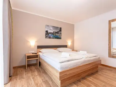Ein Bett oder Betten in einem Zimmer der Unterkunft Appartements Hollin by we rent, JOKERCARD INCLUDED