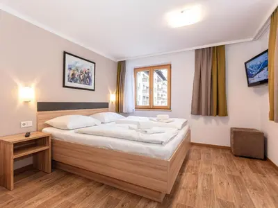 Ein Bett oder Betten in einem Zimmer der Unterkunft Appartements Hollin by we rent, JOKERCARD INCLUDED