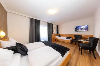 Ein Bett oder Betten in einem Zimmer der Unterkunft Villa Austria Saalbach