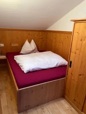 Ein Bett oder Betten in einem Zimmer der Unterkunft Stablerhof