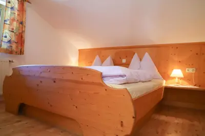 Ein Bett oder Betten in einem Zimmer der Unterkunft Stablerhof