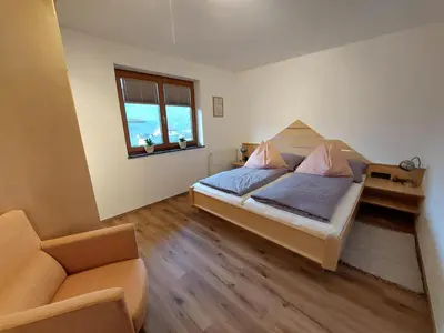 Ein Bett oder Betten in einem Zimmer der Unterkunft Ferienwohnung Tommarlhof