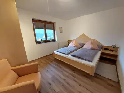 Ein Bett oder Betten in einem Zimmer der Unterkunft Ferienwohnung Tommarlhof
